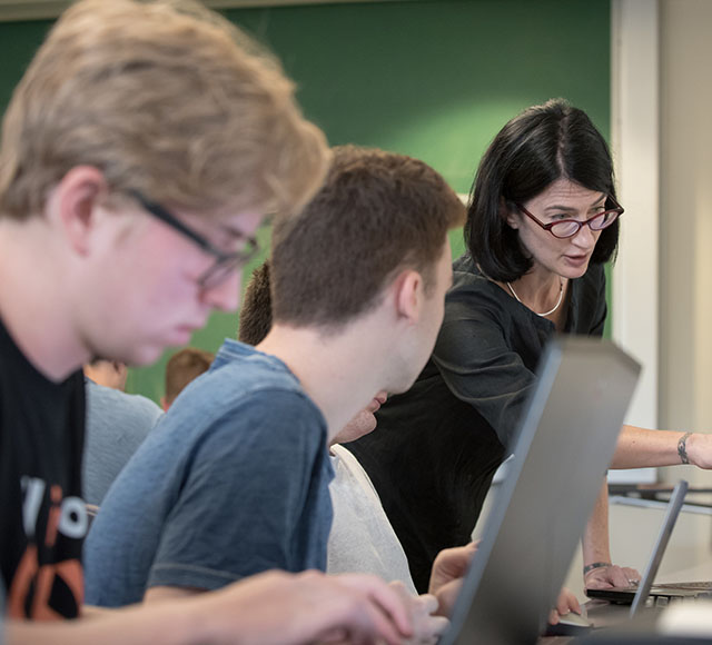 Professor Kathryn Leonard works hands-on with students in a Computer Science class