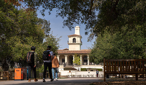 Students walk across the quad in front of Johnson Student Center
