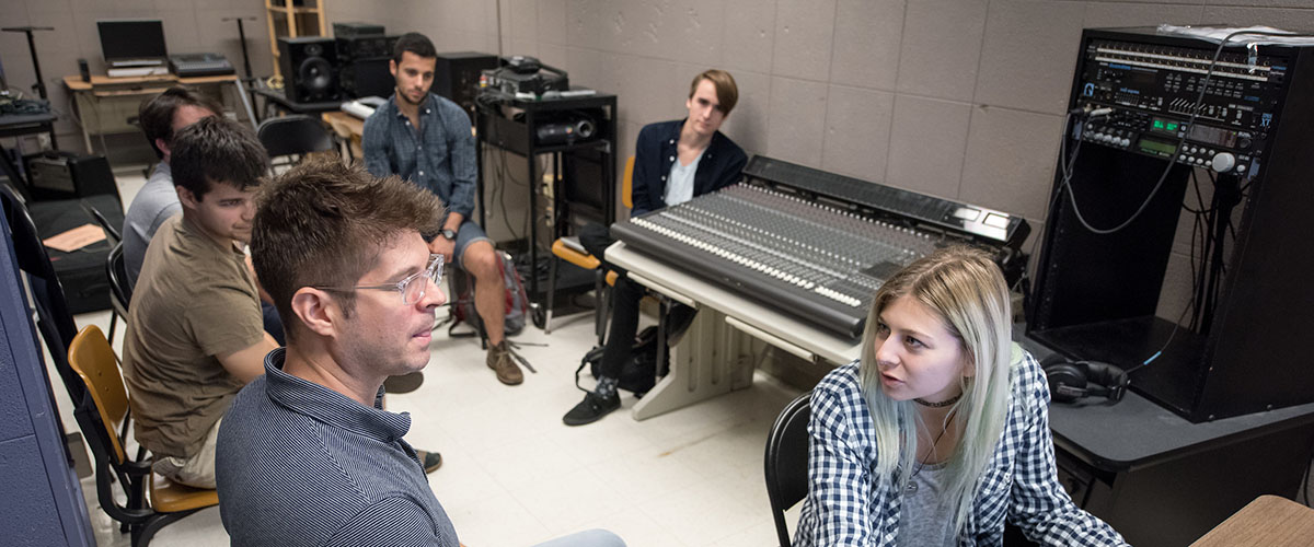 Students with Professor Adam Schoenberg in an Oxy music studio