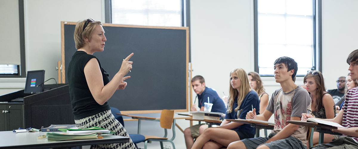 Students listen attentively to Professor Kristi Upson-Saia during a class
