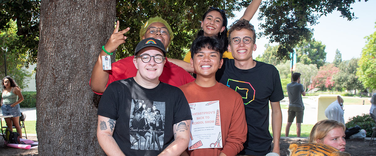 students at Oxy's involvement fair, posing as a group