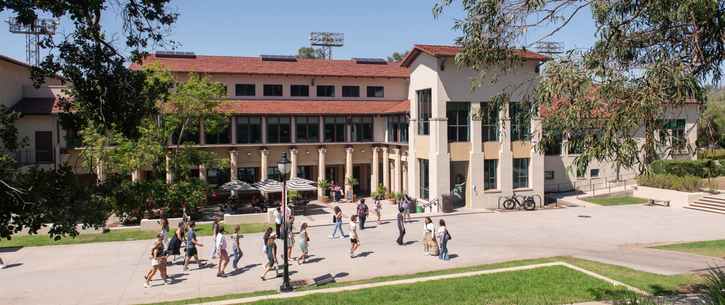 An image of the Johnson Student Center Quad, with students walking. 