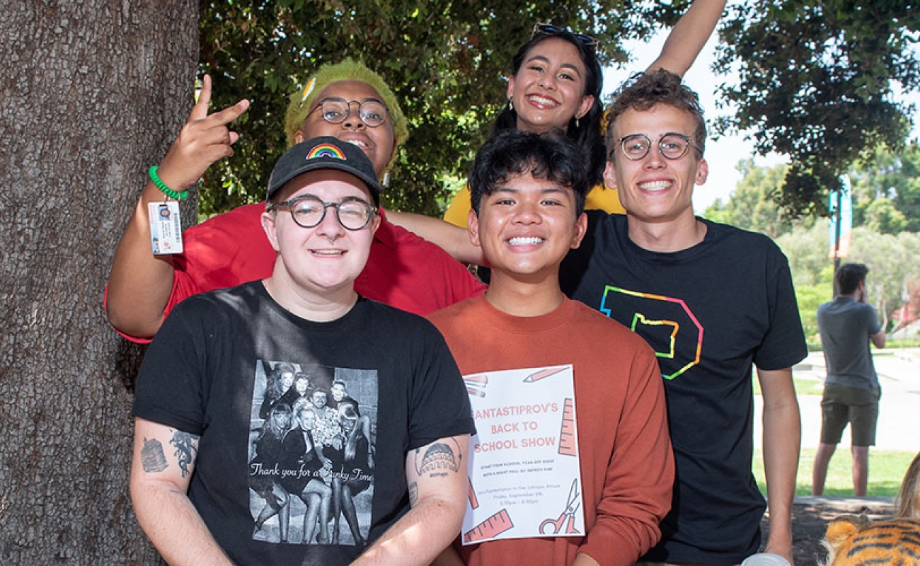 students at Oxy's involvement fair, posing as a group