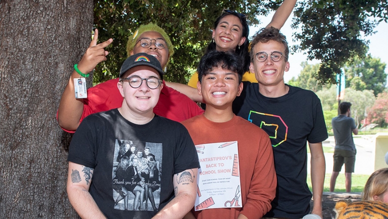 students at Oxy's involvement fair, posing as a group