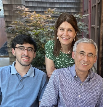 The Mohebbi family are shown together, smiling.